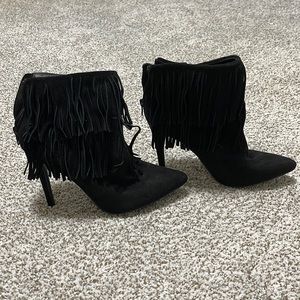 Tasseled statement heels